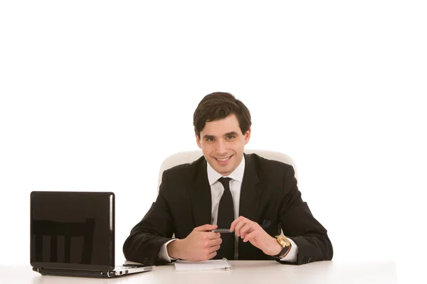 Empresário bem sucedido sentado em sua mesa — Fotografia de Stock