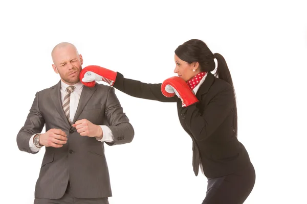 Competitive businesswoman knocks-out competitor — Stock Photo, Image