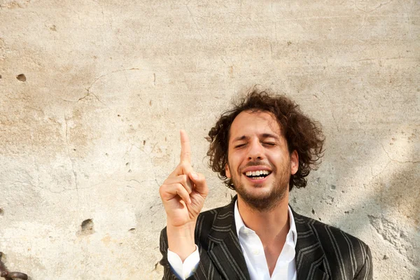 Boy shows a blank wall — Stock Photo, Image