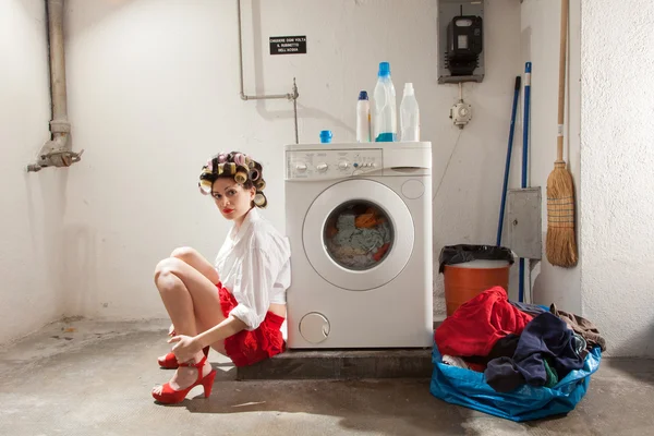 Housewife bored in the laundry — Stock Photo, Image