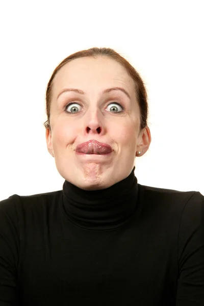 Close-up retrato de uma mulher com a língua para fora sobre um fundo branco — Fotografia de Stock