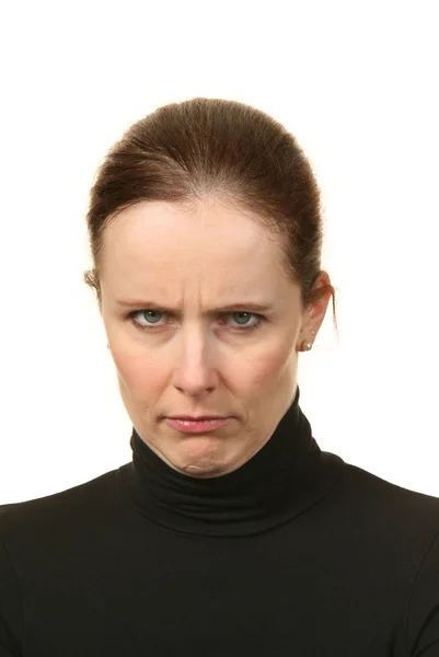 Close-up portrait of a young woman doing a pout expression, over a white background — Stock Photo, Image