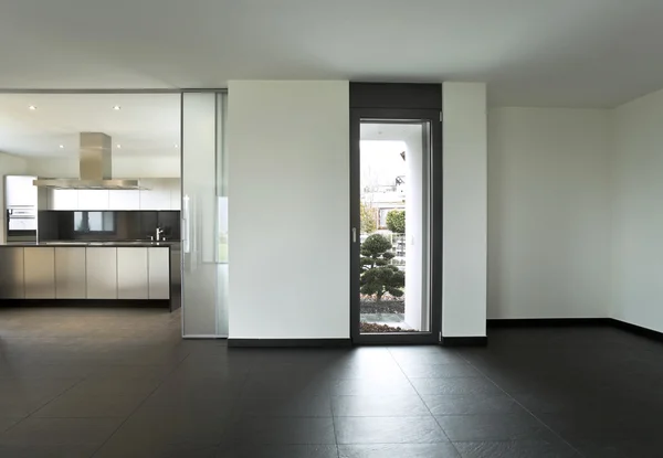 Vista desde la cocina de un nuevo apartamento, muebles grises —  Fotos de Stock