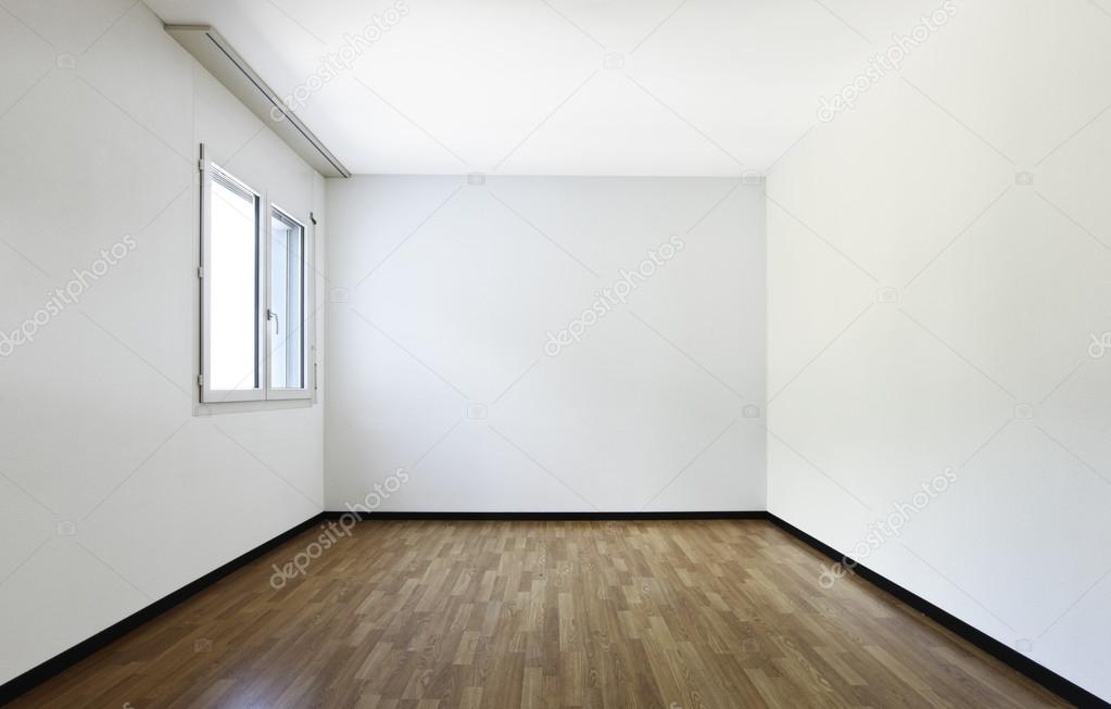 empty room in a new apartment with wooden floors and white walls and a  serious mildew and mold problem