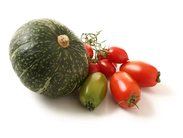 Vegetables - green pumpkin and tomatoes isolated on white — Stock Photo, Image