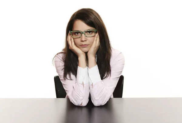 Businesswoman sitting on desk — Stock Photo, Image