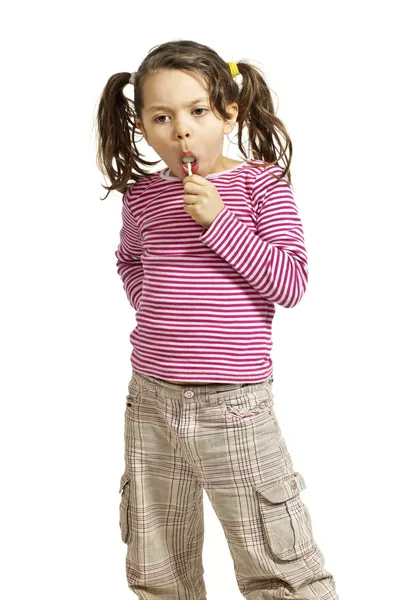 Menina com um pirulito — Fotografia de Stock