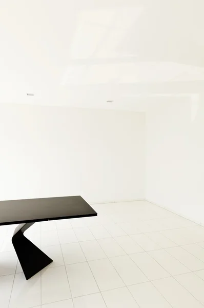 Empty room with black table