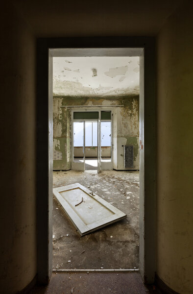 Abandoned building, room view from the door