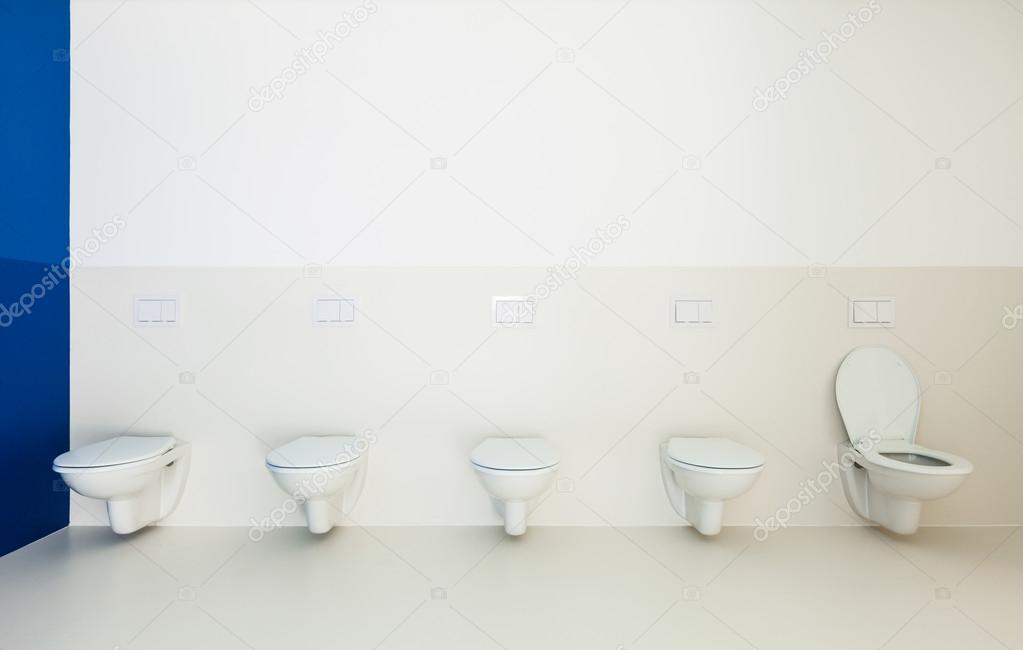 Public bathroom, toilets in a row Stock Photo by ©Zveiger 43032973