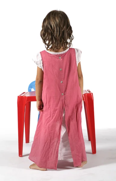 Little girl   standing at  table — Stock Photo, Image