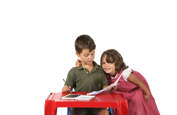 Kinderen aan de tafel — Stockfoto