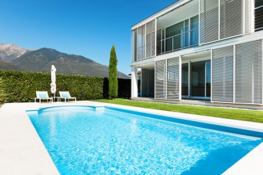 Modern villa with pool clipart