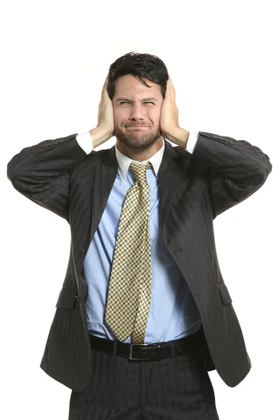 Businessman closing his ears — Stock Photo, Image