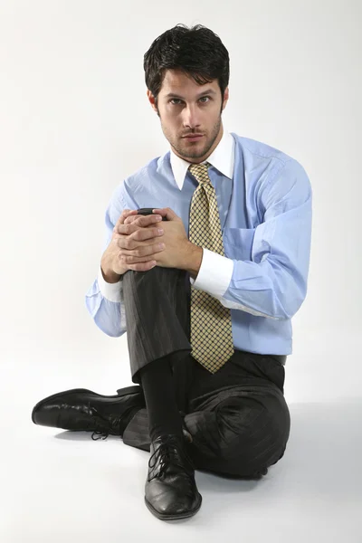 Podnikatel sedí — Stock fotografie