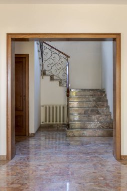 Front view marble staircase, iron railing. Interior of empty old villa to be renovated. Nobody inside clipart