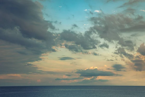 Calm sea with cloudy sky at sunset. Panorama of the Mediterranean sea in Liguria. Nobody inside