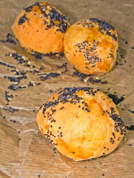 Cheese profiteroles sprinkled with poppy seeds — Stock Photo, Image