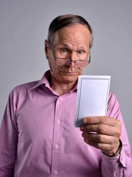 Senior surprised at the bill — Stock Photo, Image