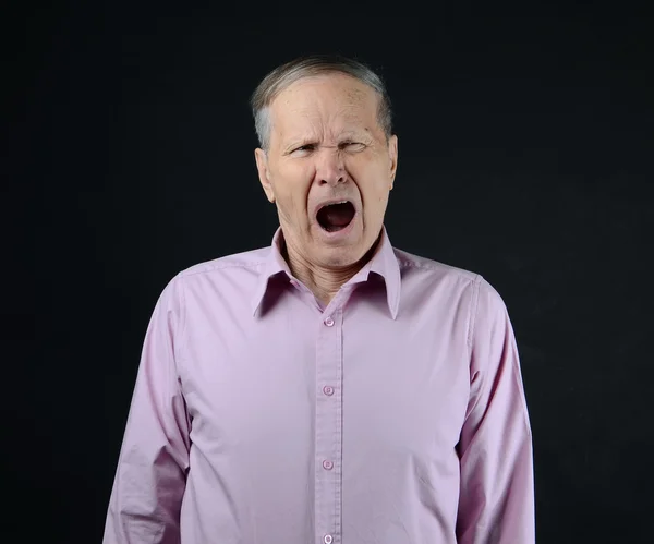 Yawning senior — Stock Photo, Image