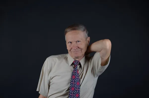 Handsome businessman scratching his back — Stock Photo, Image