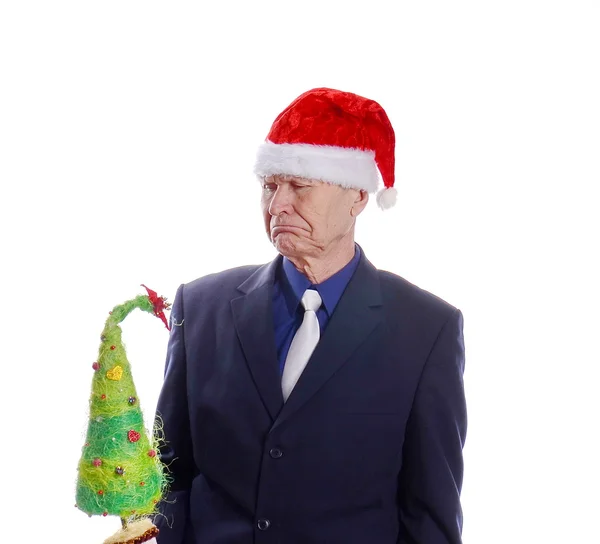 Geschäftsmann mit Weihnachtsbaum in der Hand — Stockfoto