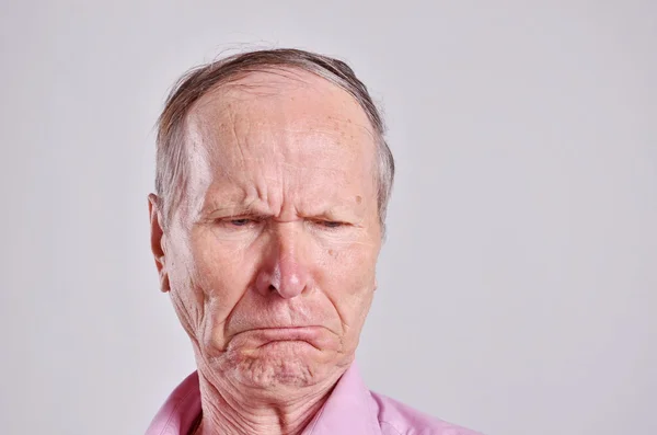 Disappointed, sad man on grey background — Stock Photo, Image