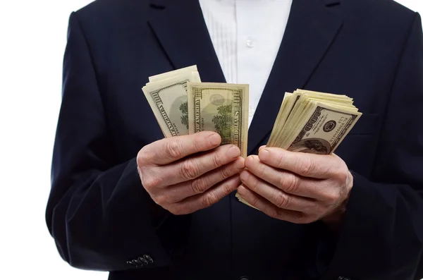Hombre contando dinero en dólares —  Fotos de Stock