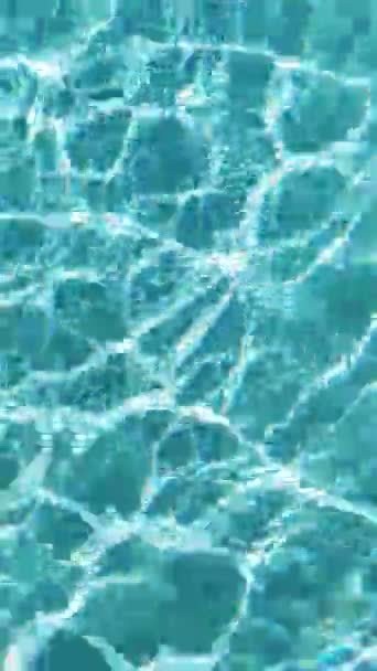 Sun glare are moving in the clear water of the swimming pool — Stock Video