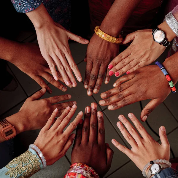 Hands of happy group of African people which stay together in circle happy.