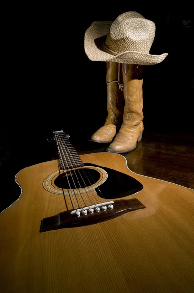 Gitarr och cowboystövlar — Stockfoto