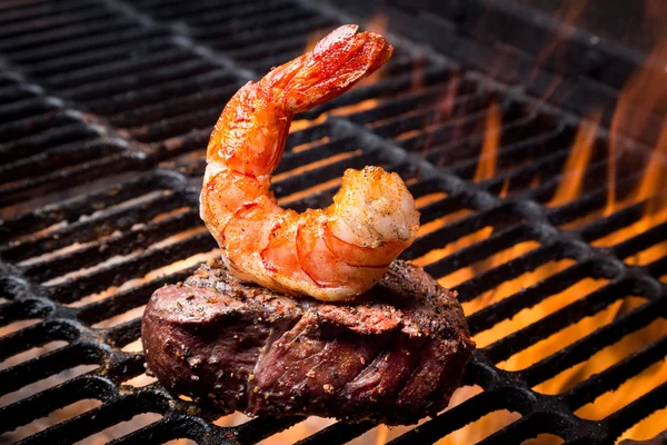 Jumbo Shrimp and Steak on a Grill Royalty Free Stock Images