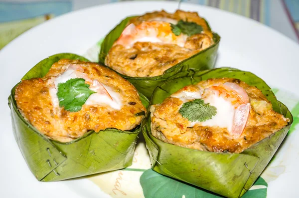 Steamed fish with curry paste on banana Leaf — Stock Photo, Image
