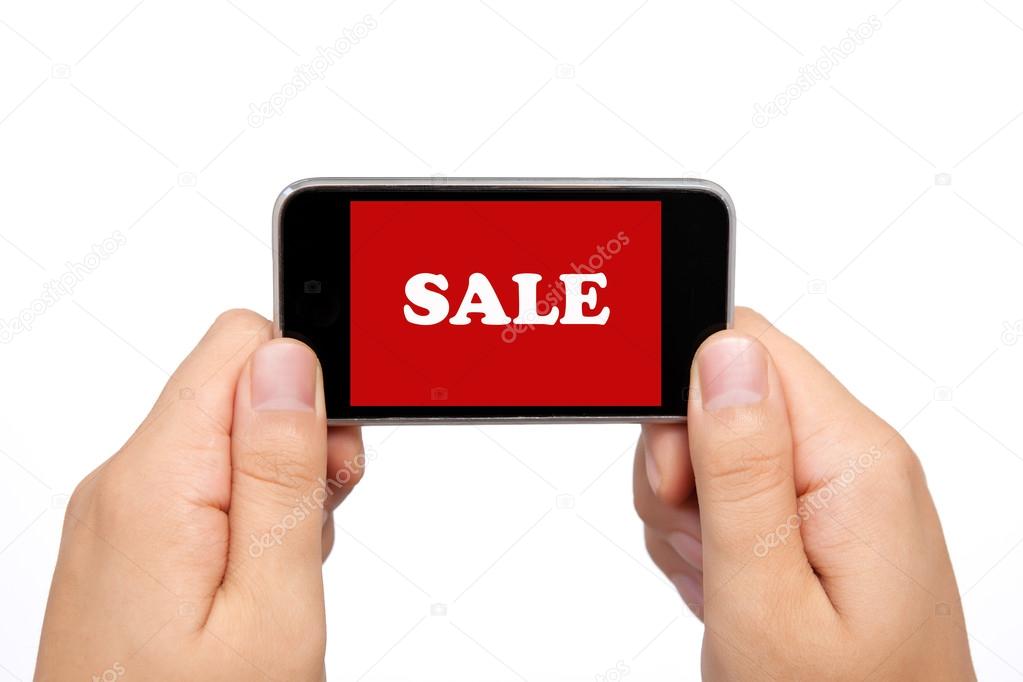 female hands holding a phone touch computer pad gadget with sale