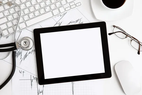 Computer tablet on the table at the doctor — Stock Photo, Image