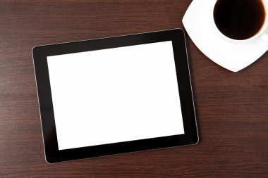 Tablet ve caffe tablosundaki bir kap