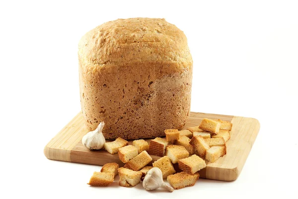 Bochník chleba, česnek a sušená — Stock fotografie