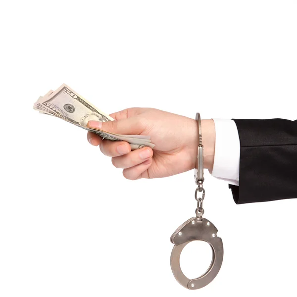 Изолированная рука бизнесмена в наручниках берет взятки деньги — стоковое фото