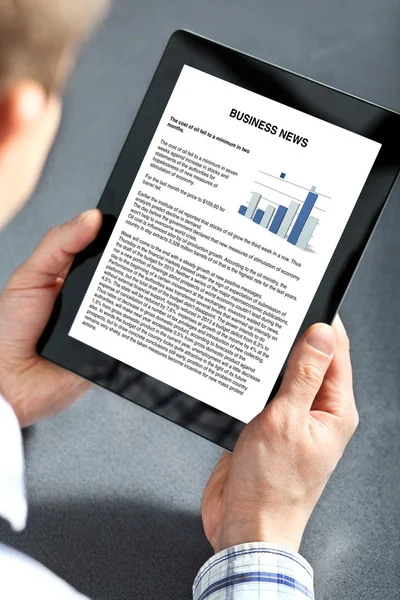 Man holding tablet with business text on the screen — Stock Photo, Image