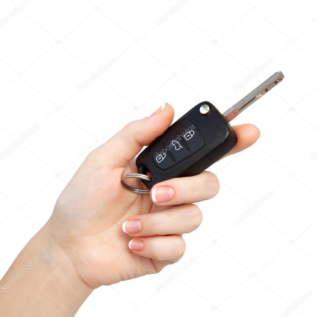 woman hand on isolated background holding car key