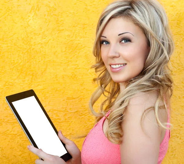 Beautiful girl holding a tablet — Stock Photo, Image