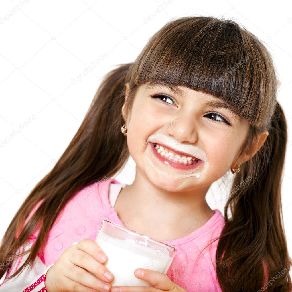 smiling girl with a glass of milk