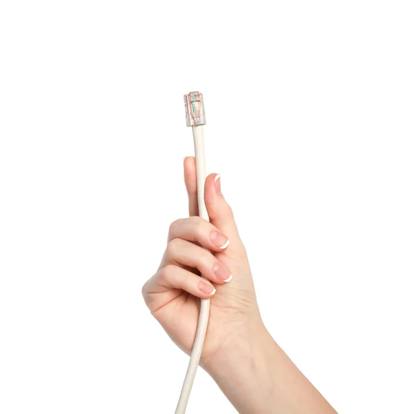 Isolated woman hand holding a computer cable — Stock Photo, Image