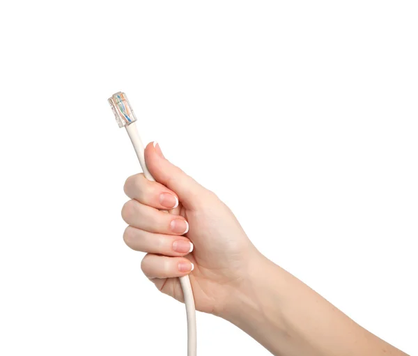 Mão mulher isolado segurando um cabo de computador — Fotografia de Stock