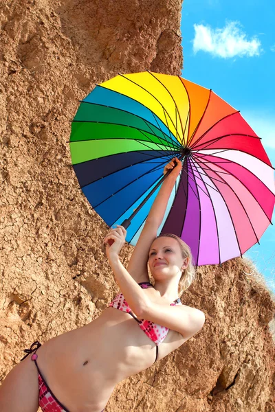 Sexy girl with a bright umbrella — Stock Photo, Image