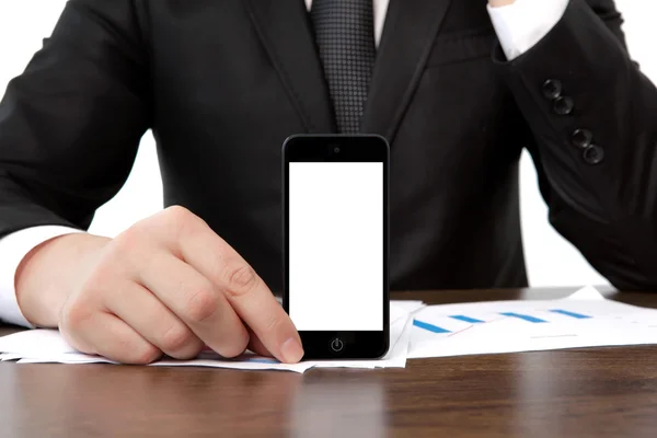 Бізнесмен в офісі тримає сенсорний телефон з ізольованою шк — стокове фото