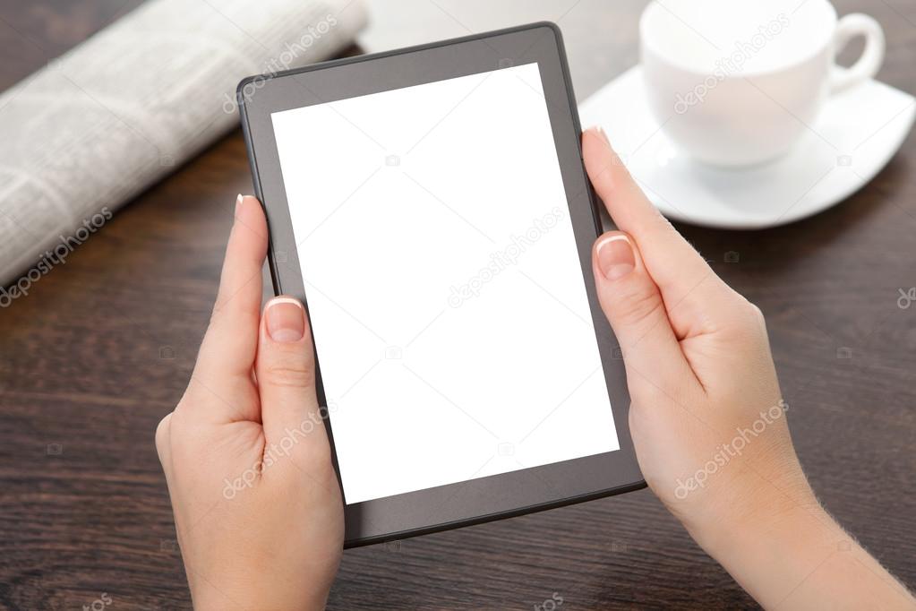 businesswoman hand holding a tablet against the background of th