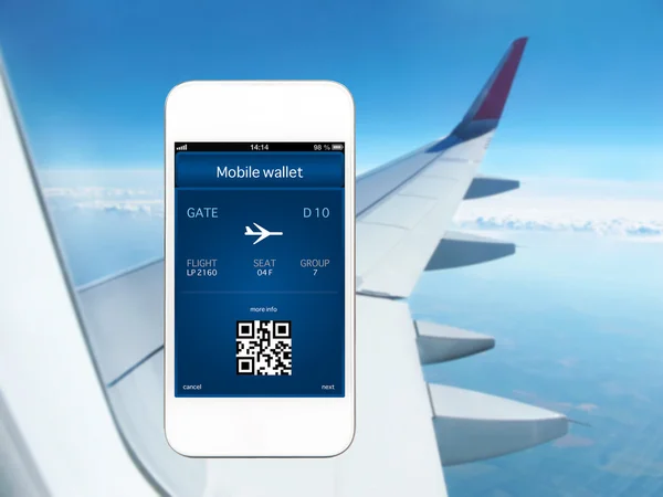 Phone with mobile wallet and plane ticket against the background — Stock Photo, Image