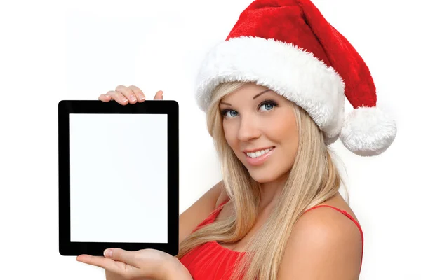 Girl in a red Christmas hat on New Year, holding tablet touch pa — Stock Photo, Image