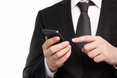 Takım elbiseli bir dokunmatik telefon tutarak izole iş adamı